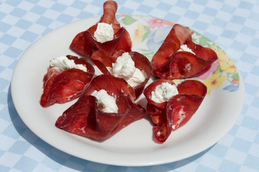 appetizer with slices of dried beef stuffed with cheese