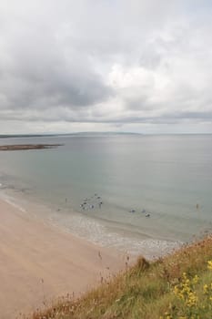 a view from the beach cliffs in ballybunion co kerry ireland at training surfing at a surf school