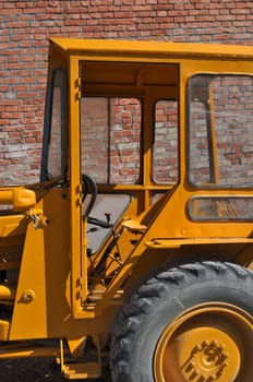 An old tractor vehicle machinery used in agriculture or construction