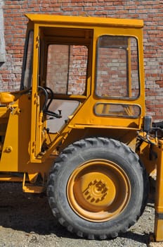 An old tractor vehicle machinery used in agriculture or construction