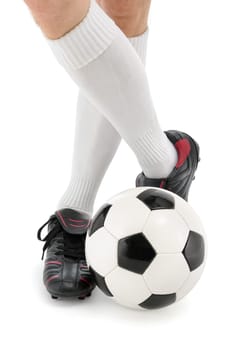 Feet of a soccer player with the ball,isolated on white