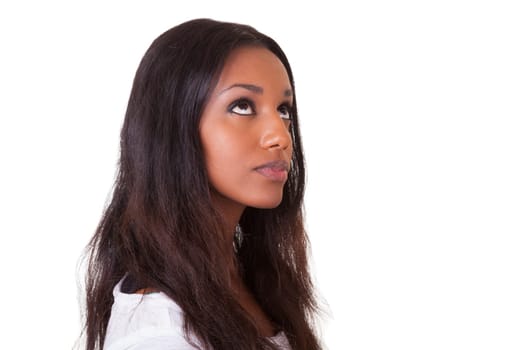Closeup portrait of a young beautiful black woman looking up