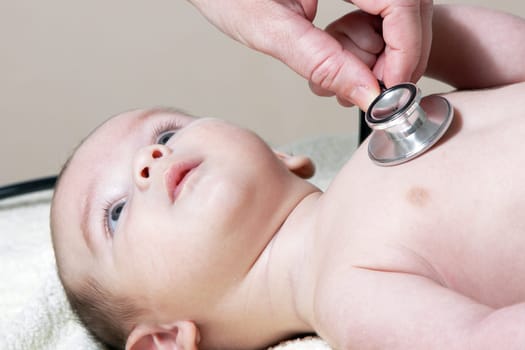 Stethoscope listening to a baby&#039 s heart beat