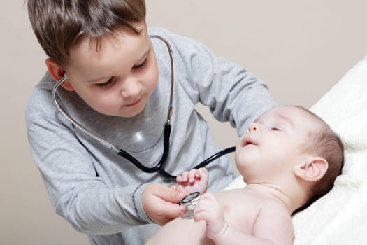 Stethoscope listening to a baby&#039 s heartbeat