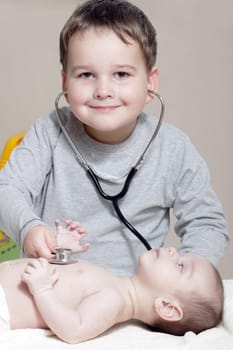 Stethoscope listening to a baby&#039 s heartbeat