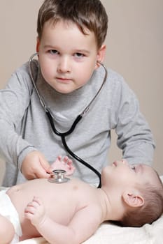 Stethoscope listening to a baby&#039 s heartbeat