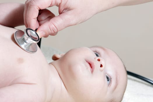 Stethoscope listening to a baby&#039 s heart beat