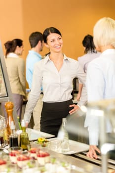 Cafeteria lunch two office colleagues chatting wait food serving queue