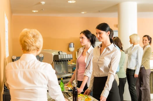 Cafeteria woman pay at cashier hold serving tray fresh food