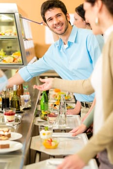 Desserts at cafeteria people with serving tray self service canteen