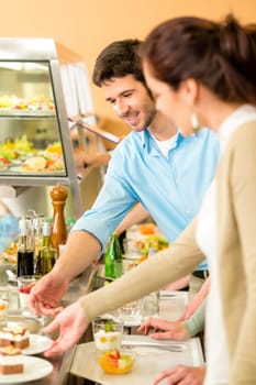 Desserts at cafeteria people with serving tray self service canteen