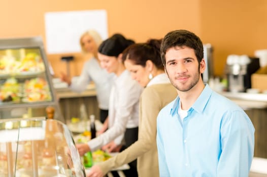 Business man take cafeteria lunch food from display cabinet self-service