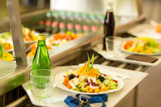 Canteen serving tray healthy fresh salad cafeteria lunch food self-service