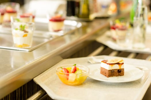 Desserts on serving tray cafeteria self service fruit salad cake