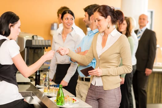 Cafeteria woman pay by credit card cashier food on serving tray