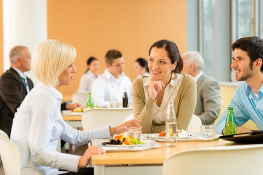 Cafeteria lunch young business people eat salad at office canteen