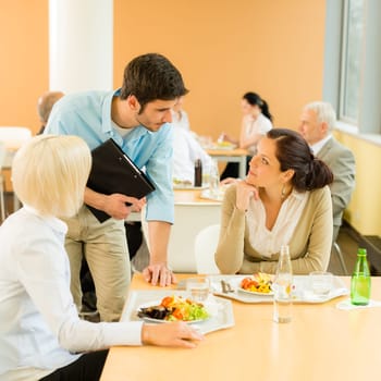 Lunch break office colleagues eat meal in cafeteria fresh salad