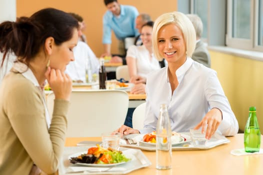 Cafeteria lunch young business woman eat salad at office canteen