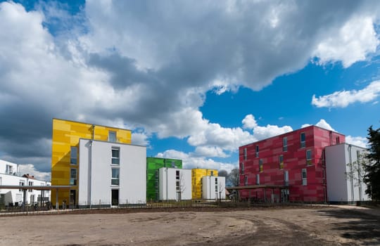 colorful new apartments under a nice cloudy sky