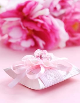 Pink present box with pacifier for baby girl