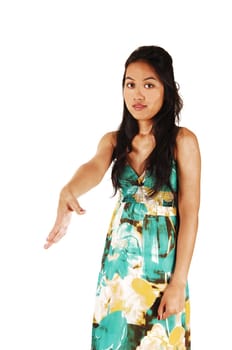 Young Asian woman stretching her hand out to great you with a handshake, in a dress and with long black hair for white background.