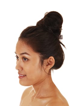 A pretty and skinny Asian woman with her long hair up and free shoulder in profile for white background.