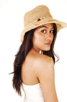 A young pretty Asian woman wearing a beige straw hat and a shoulder  free top, with long brunette hair, for white background.