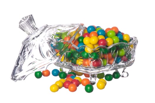 colored candy in a container of crystal on a white background