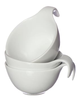 three ceramic cups on a  white background