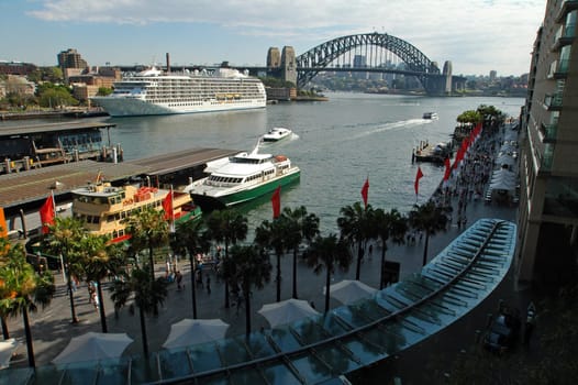 Sydney&#039 s Circular Quay, big white boat anchoring, Harbour bridge in background, no advertisment in picture