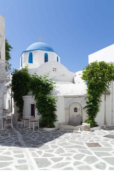 Classical street with a painted sidewalk in Parikia