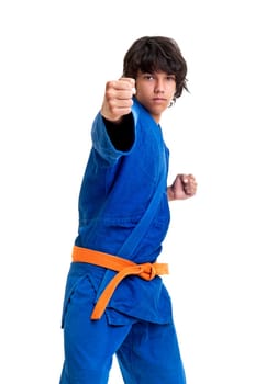 Young fighter posing against a white background