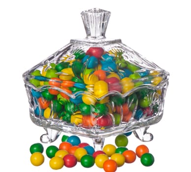 colored candy in a container of crystal on a white background