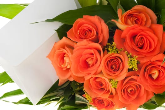 Bouquet of orange roses and ticket on a white background