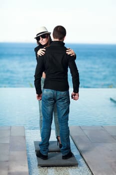 Young couple. Sea on the background