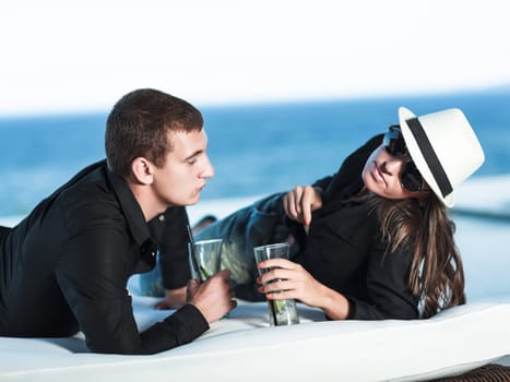 Young couple. Sea on the background