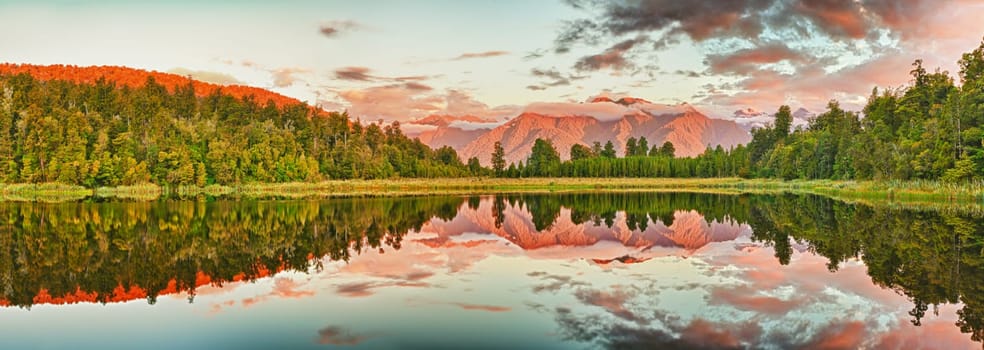 Reflection of the mountains in Matheson lake. Panorama