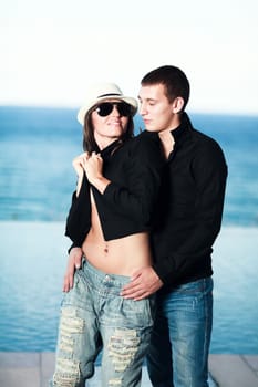 Young couple. Sea on the background