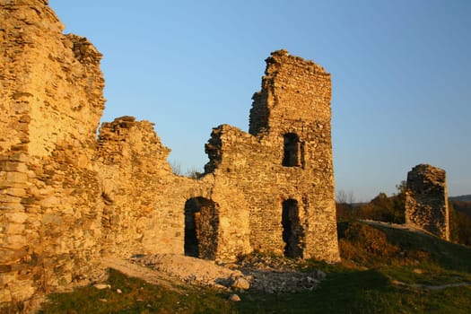 Ruins of old castle in the light of the sunset (Europe)