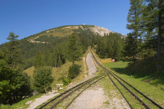Mountain view with cogwheel railway (Mountain named Schneeberg, Austria). Horizontally.