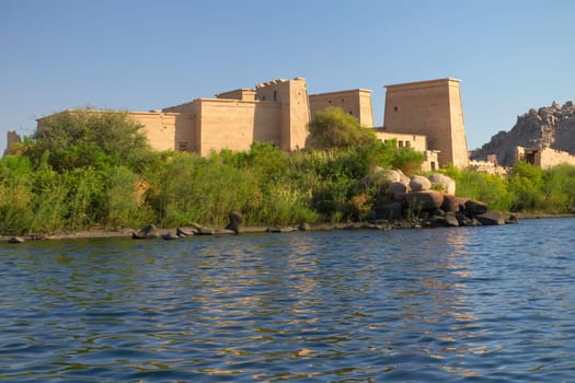 The Temple of Isis at Philae island in Lake Nasser, seen from a boat. Near the town of Aswan ( Egypt). Horizontally.