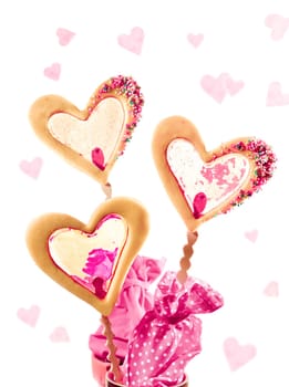 three cookies on a stick with caramell filling maybe for valentine as a card