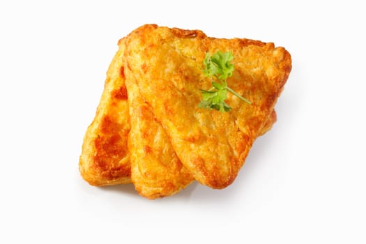 3 Potato Rosti isolated on white with parsley
