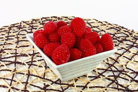Fresh raspberries in the bowl