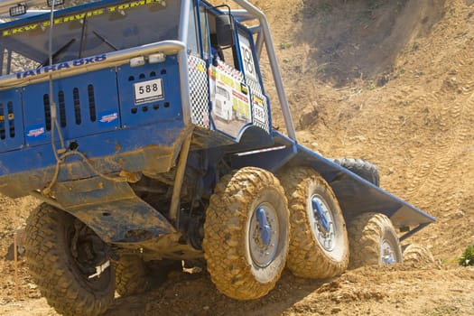 MOHELNICE, CZECH REPUBLIC - MAY 20. Unidentified racer at blue truck  passes through difficult terrain in the "Grand Prix Truck Trial 2012"" on May 20, 2012 in the town of Mohelnice, Czech Republic."