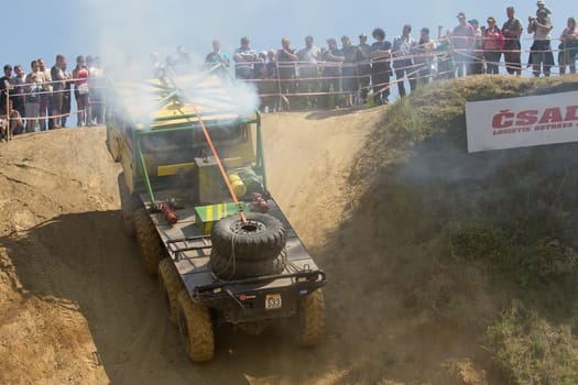 MOHELNICE, CZECH REPUBLIC - MAY 20. Unidentified racer leaves steep slope in the "Grand Prix Truck Trial 2012"" on May 20, 2012 in the town of Mohelnice, Czech Republic."
