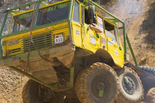 MOHELNICE, CZECH REPUBLIC - MAY 20. Unidentified racer at yellow trruck passes through difficult terrain in the "Grand Prix Truck Trial 2012"" on May 20, 2012 in the town of Mohelnice, Czech Republic."