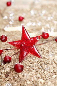Single Christmas star and some other decorative elements on a golden background