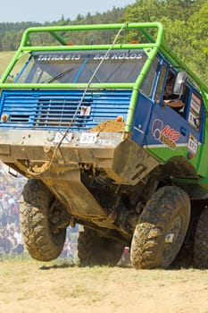 MOHELNICE, CZECH REPUBLIC - MAY 20. Unidentified racer at green truck passes through difficult terrain in the "Grand Prix Truck Trial 2012"" on May 20, 2012 in the town of Mohelnice, Czech Republic."