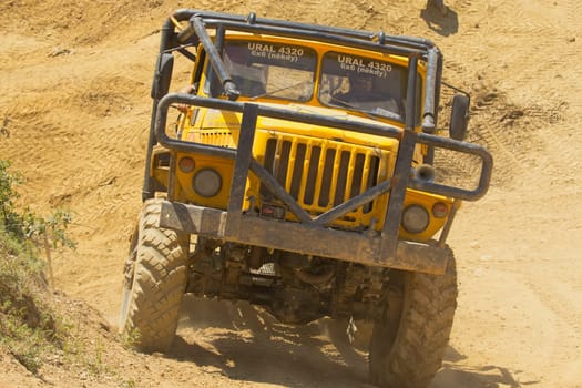 MOHELNICE, CZECH REPUBLIC - MAY 20. Unidentified racer at yellow truck leaves steep slope in the "Grand Prix Truck Trial 2012"" on May 20, 2012 in the town of Mohelnice, Czech Republic."
